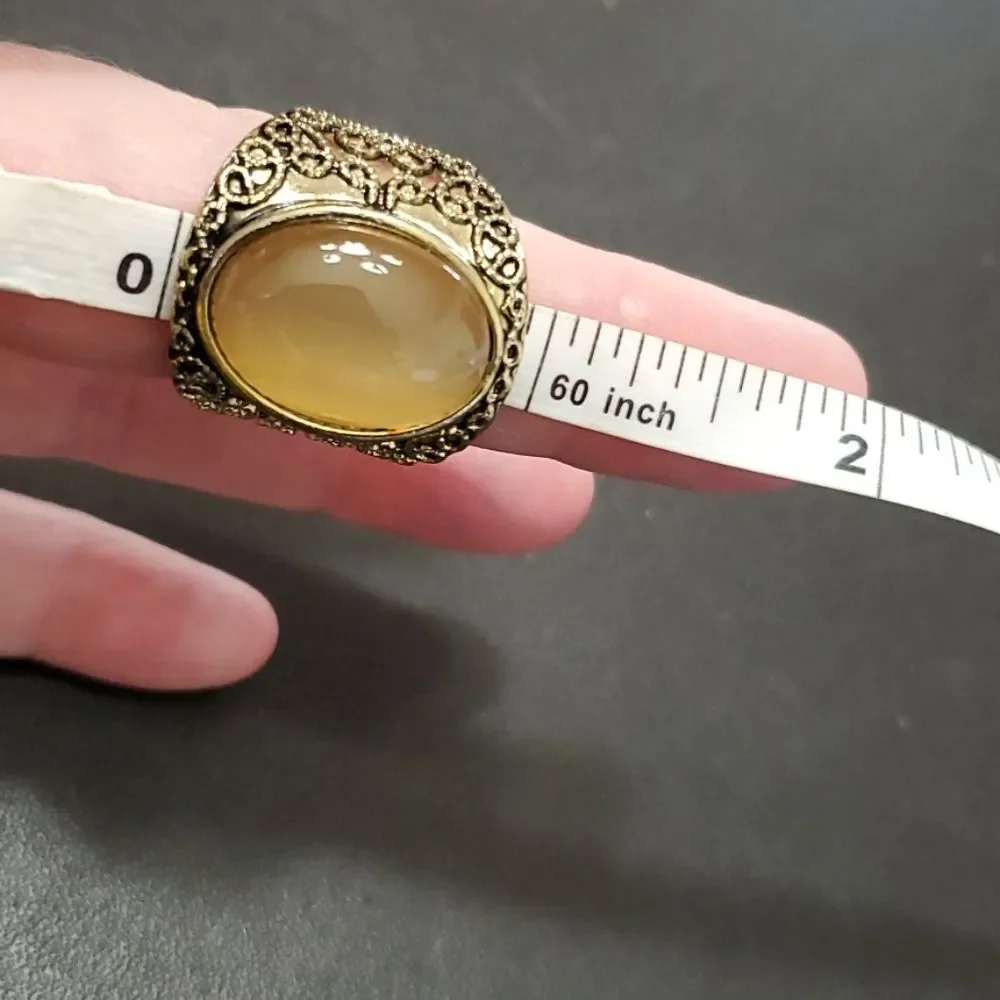 Gold tone ring with stone